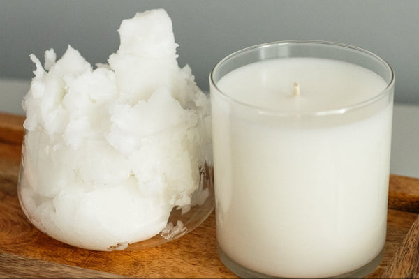 Raw soy wax beside a finished poured candle, the same material before and after it becomes a candle.