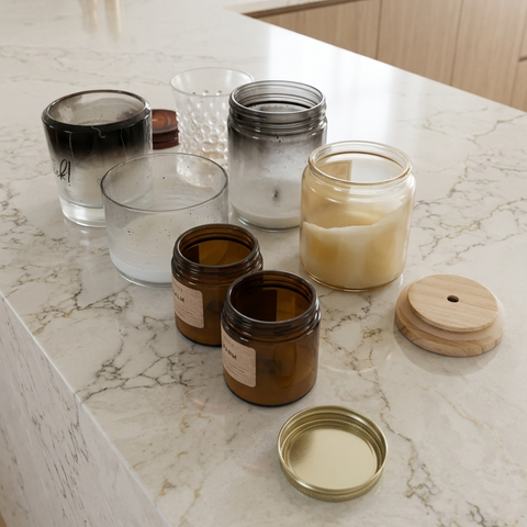 Empty candle jars on countertop